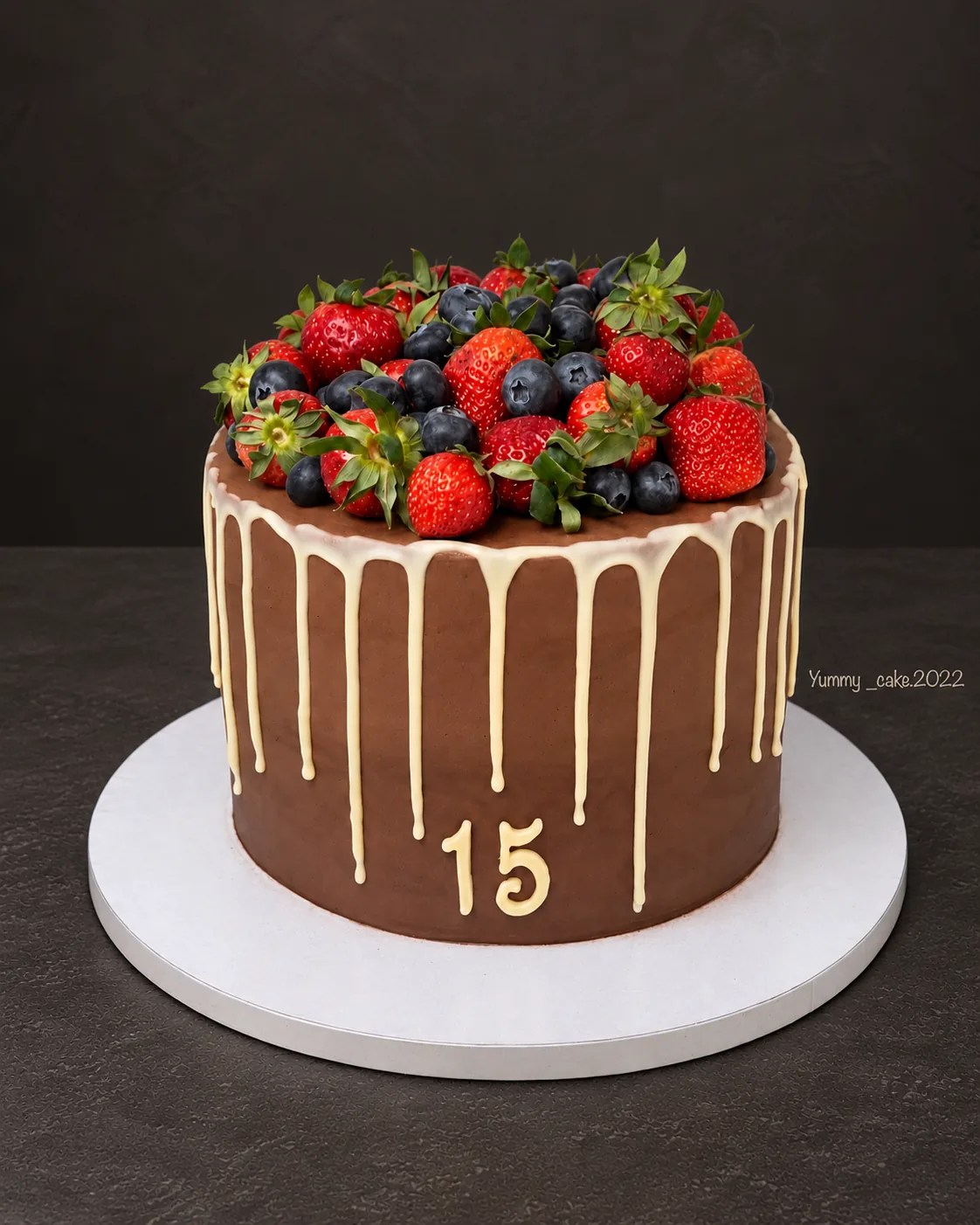 Chocolate drip cake with berries
